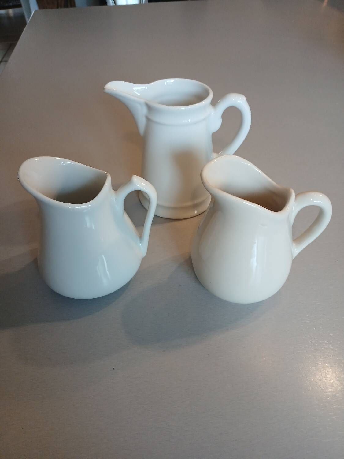 3 small antique porcelain pitchers/milk pots