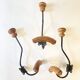 Trio of antique wooden and metal coat hooks