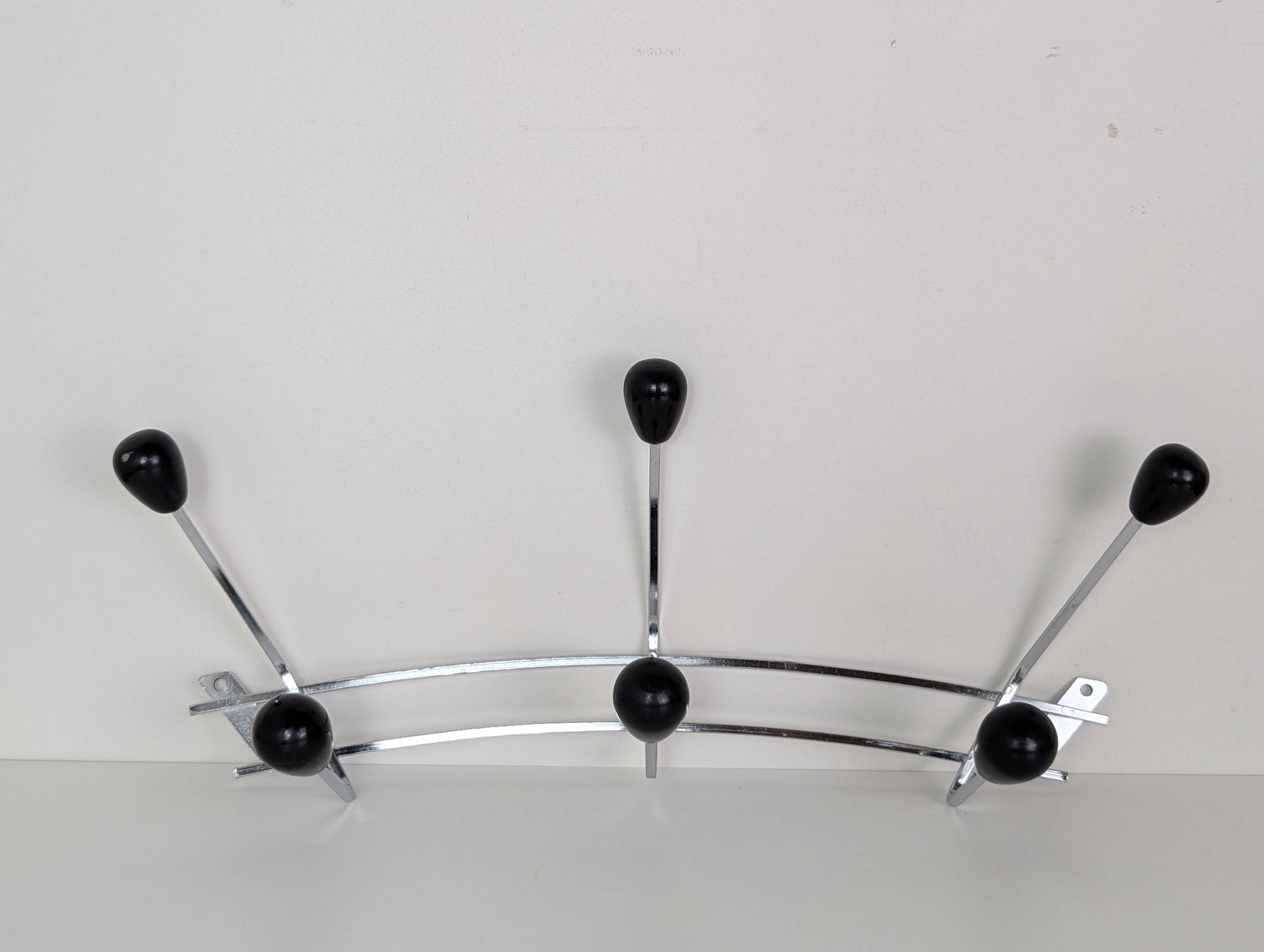 Chrome wall-mounted coat rack