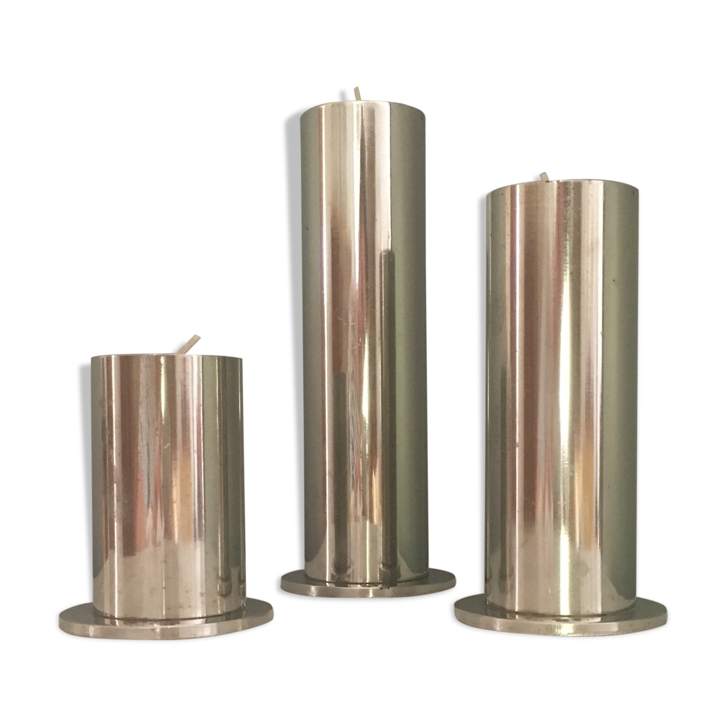 Suite of three brushed steel candlesticks from the 1970s