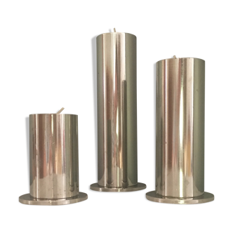 Suite of three brushed steel candlesticks from the 1970s