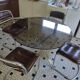 Round kitchen table with smoked glass top and 4 chairs from the 1970s.
