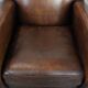 Characterful vintage sheepskin leather armchair with beautiful colours