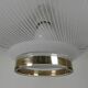 UFO-shaped pendant lamp with white glass on top and clear glass with white