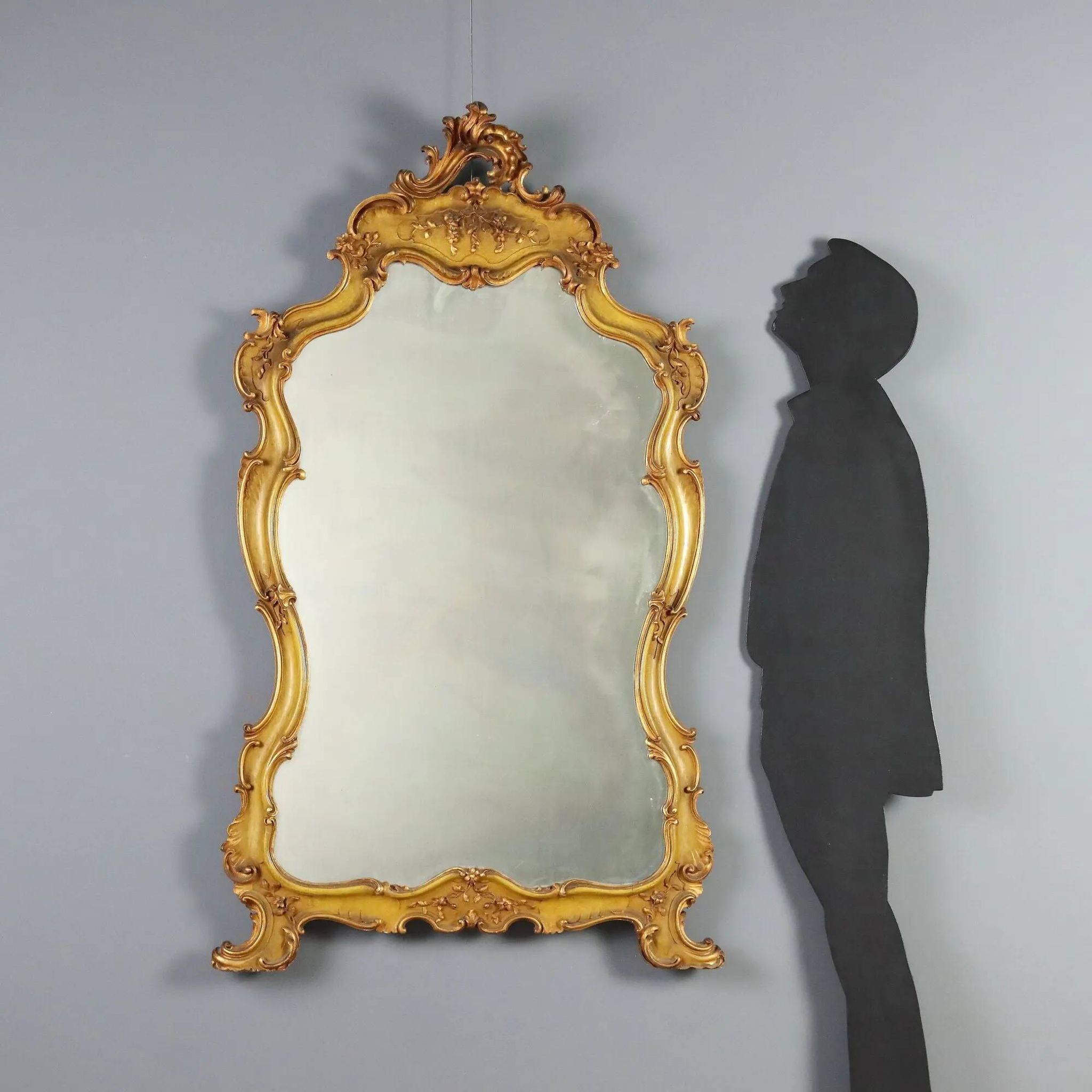 Antique baroque-style mirror in gilded carved wood, Italy 19th century.