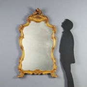 Antique baroque-style mirror in gilded carved wood, Italy 19th century.