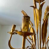 Golden suspension 5 fires with a bouquet of ears of wheat