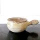 Beige glazed terracotta caquelon