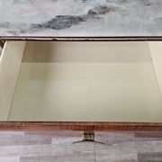 Mid-century drawer chest in mahogany, brass and glass.