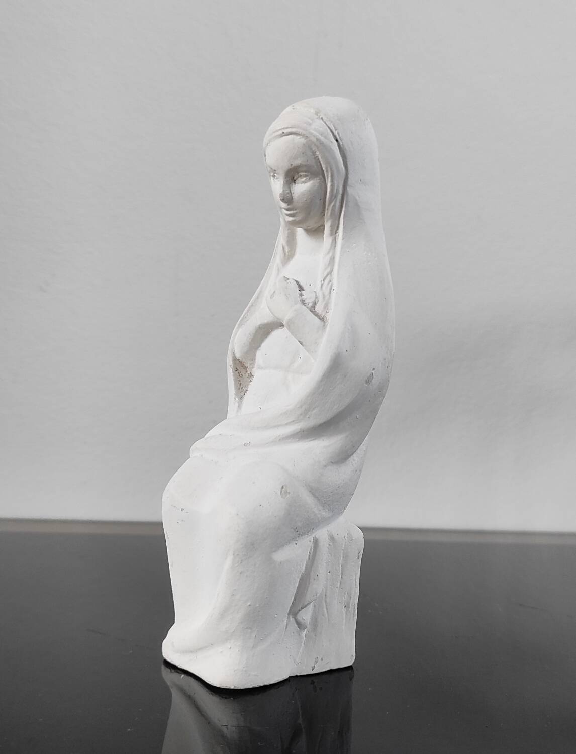 Vintage white plaster statuette of the Virgin Mary.