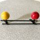 Vintage wall coat rack, metal and wood in yellow and red.