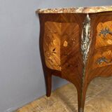 Louis XV style commode with floral marquetry decoration.