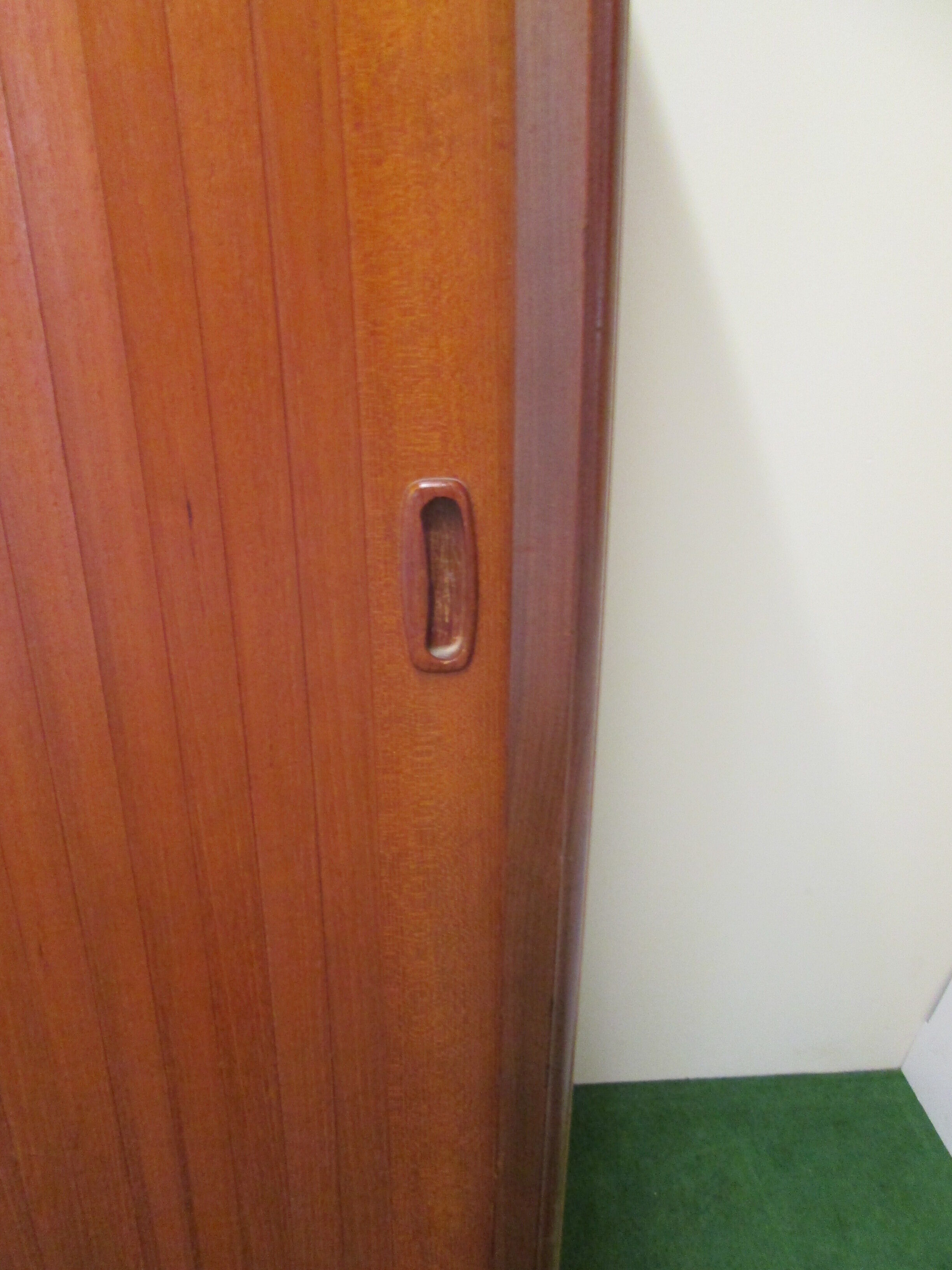 Teak cabinet with shuttered sliding door