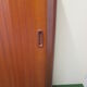 Teak cabinet with shuttered sliding door