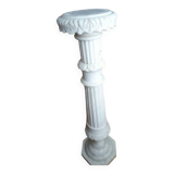 Saddle column in fluted white marble with floral motifs.