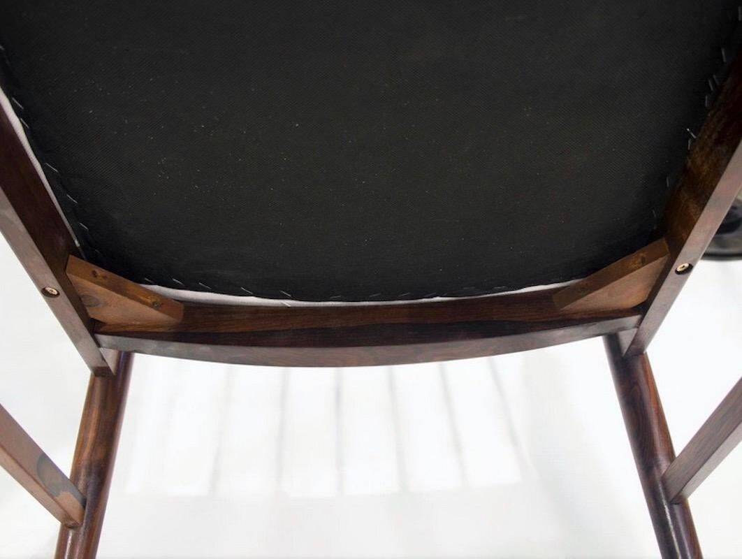 Set of six wooden dining chairs Arne Vodder Model No 422 with fabric upholstery.