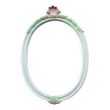Vintage oval mirror in carved wood in pastel tones