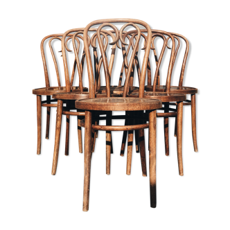 Six patinated bistro chairs