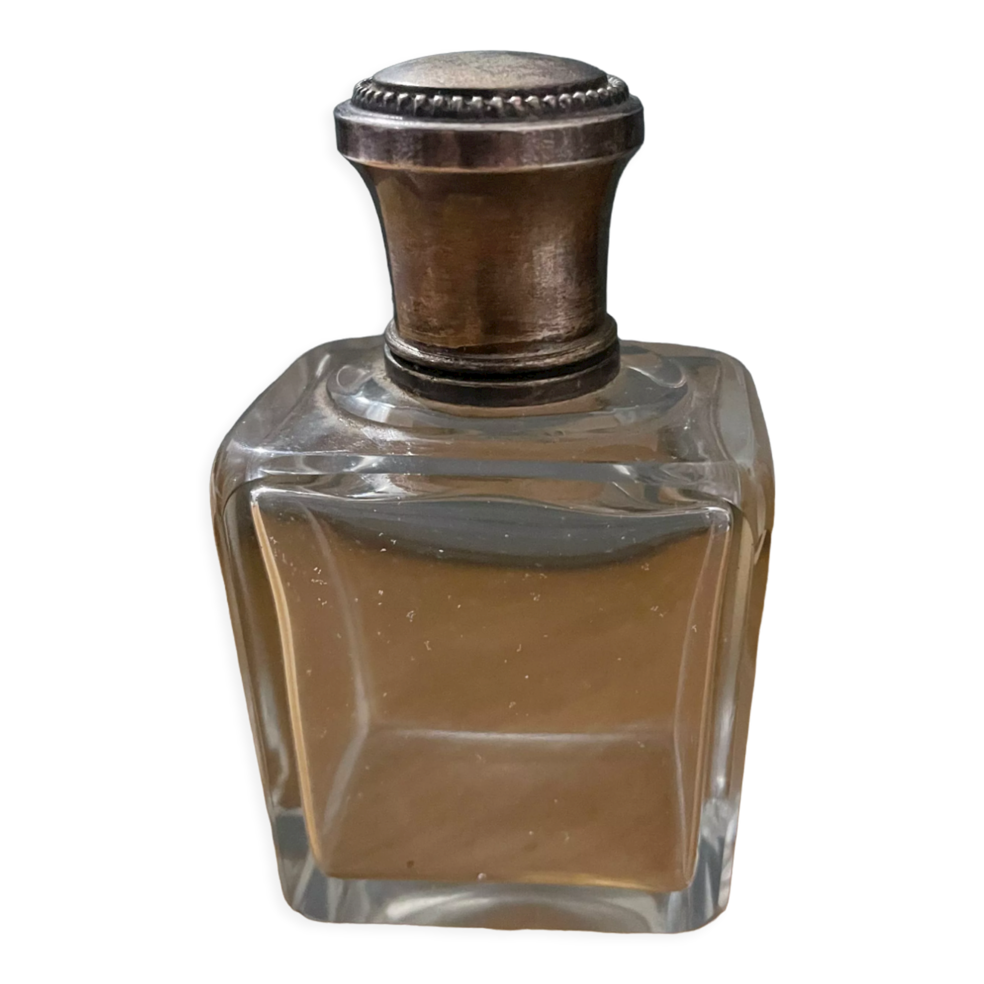 Old perfume bottle silver metal cap