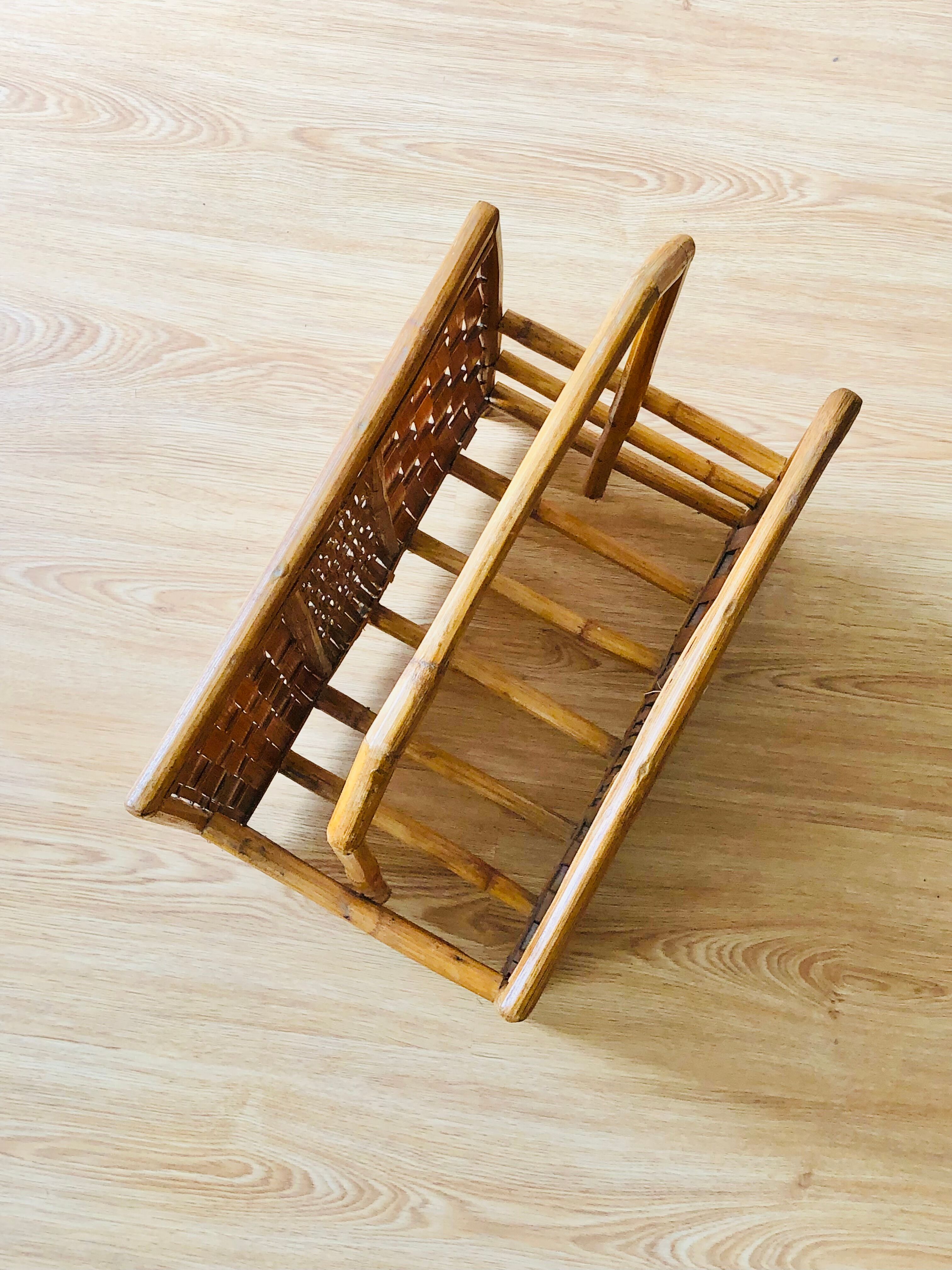 Vintage rattan magazine holder with floral decoration