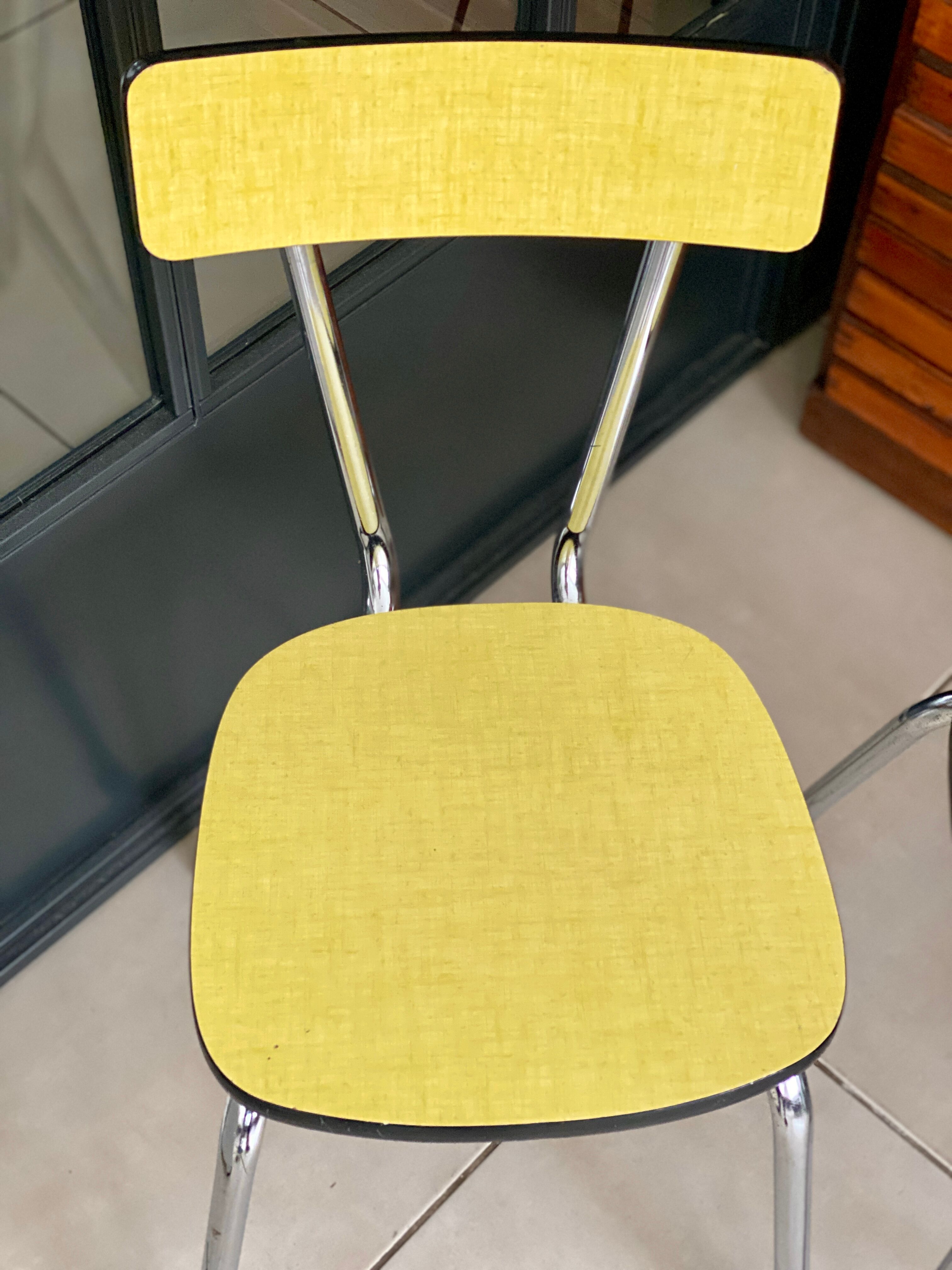 Pair of yellow formica chairs