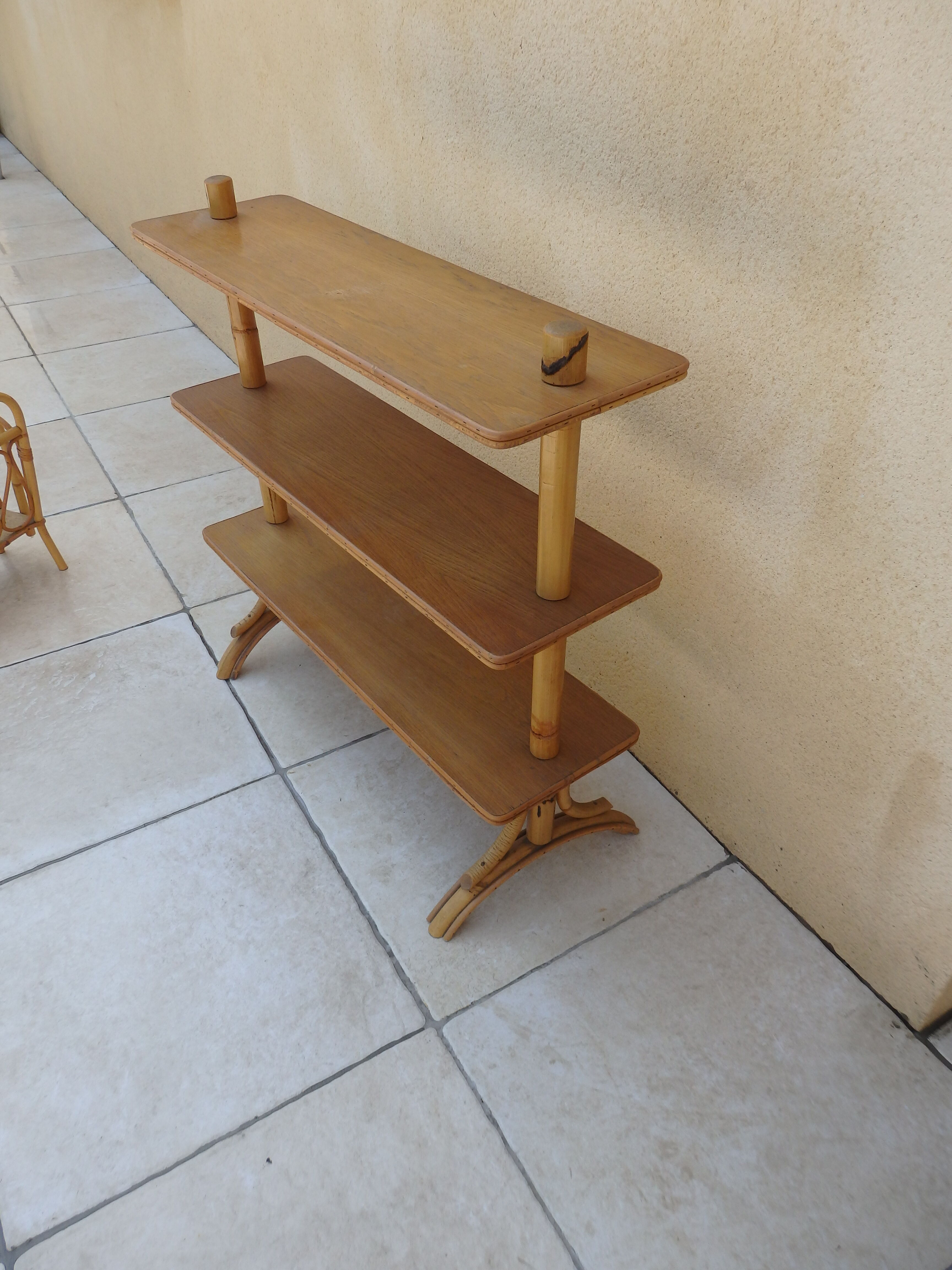 Vintage rattan shelf on feet