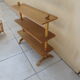 Vintage rattan shelf on feet