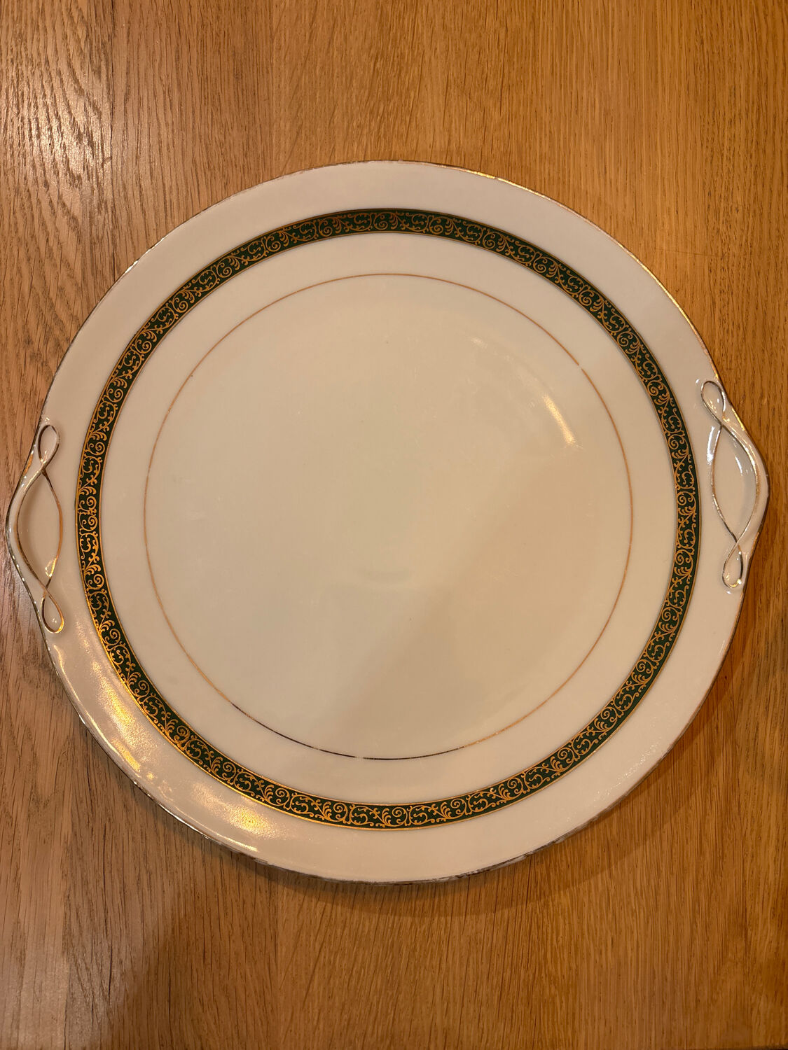 Complete old service in green and gold Limoges porcelain.