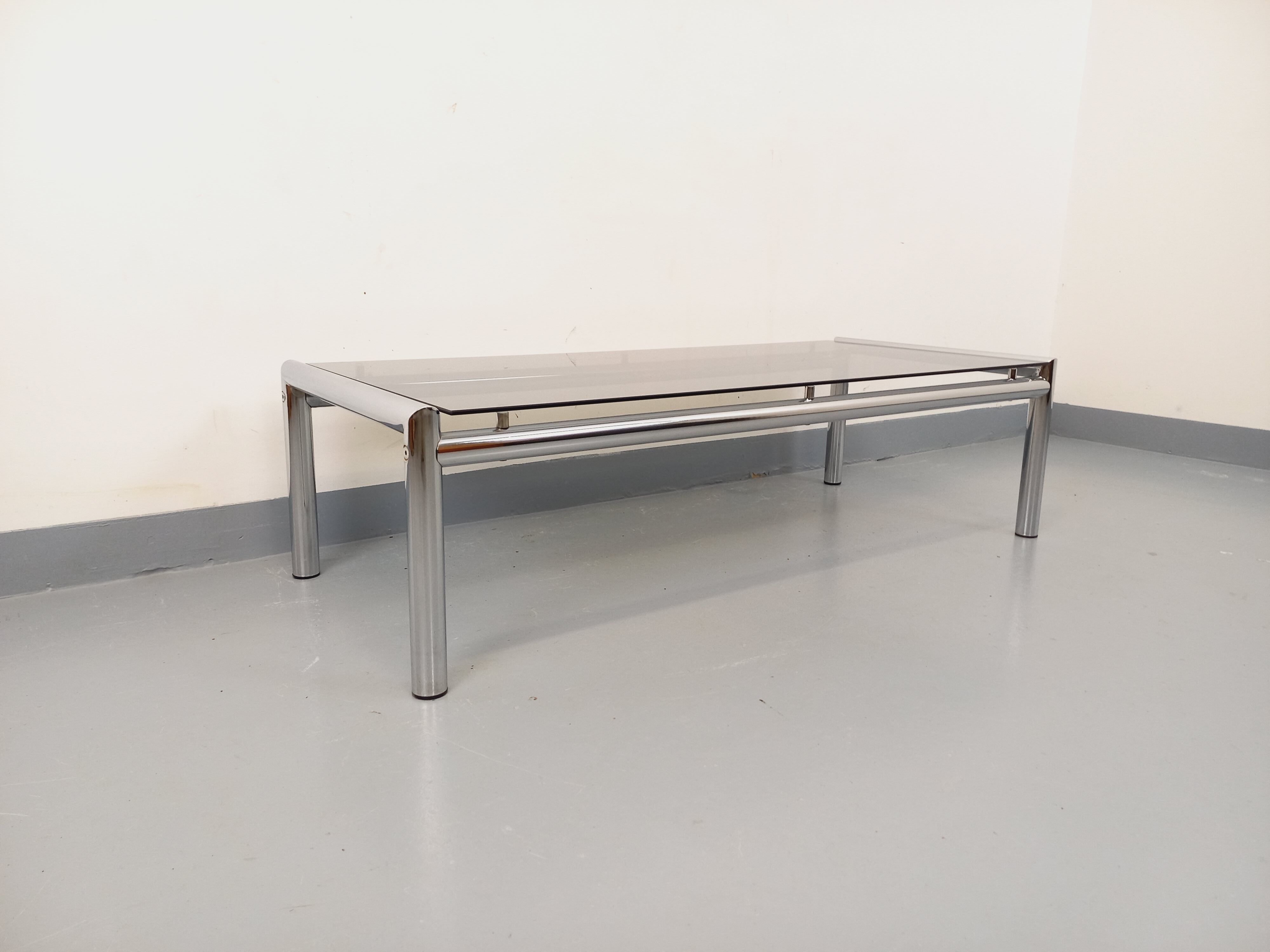 Vintage rectangular coffee table in smoked glass and chrome metal from the 1960s.