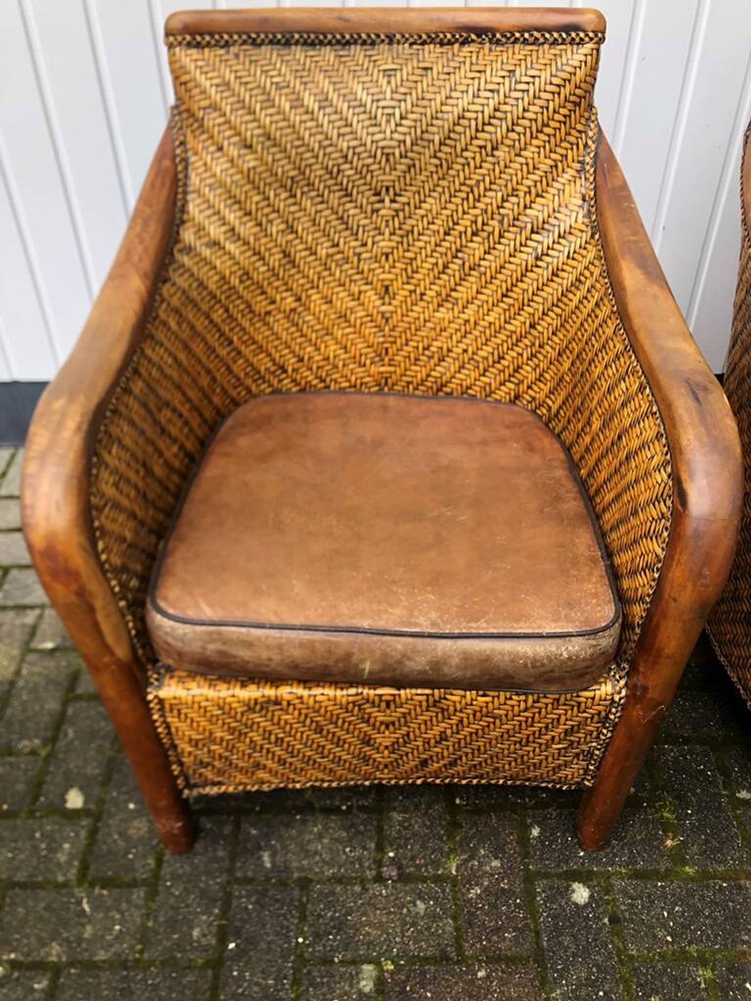 2 colonial armchairs in wood, rattan and leather, 1950s