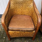 2 colonial armchairs in wood, rattan and leather, 1950s