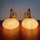 Pair of brass and yellow/white speckled glass wall sconces