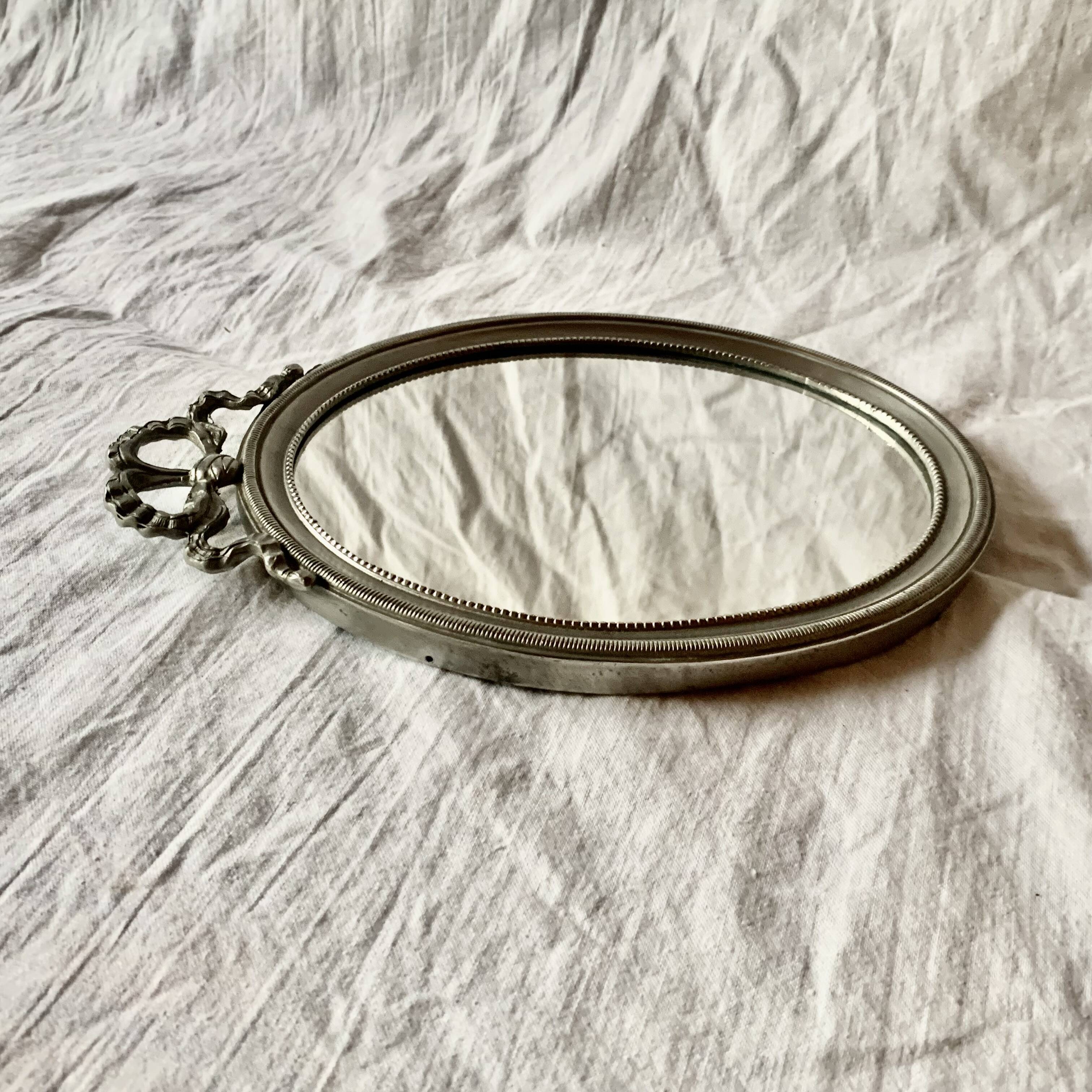 Louis XVI style oval metal wall mirror
