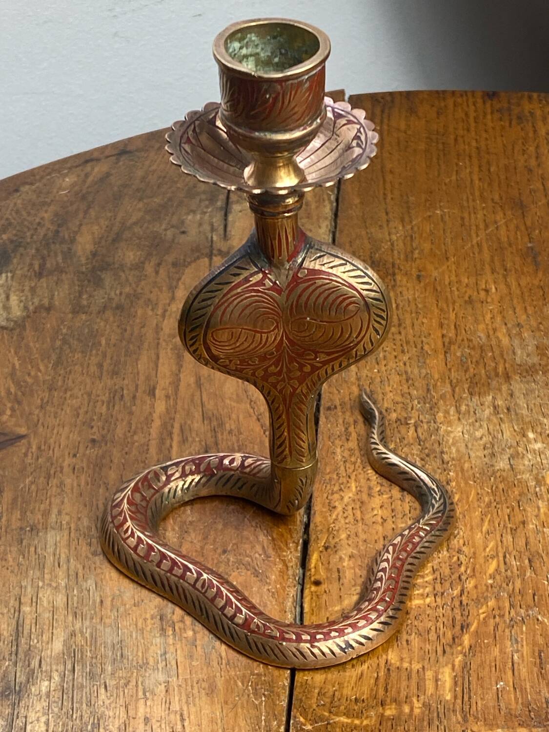 Chiseled brass cobra candlestick