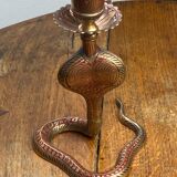 Chiseled brass cobra candlestick