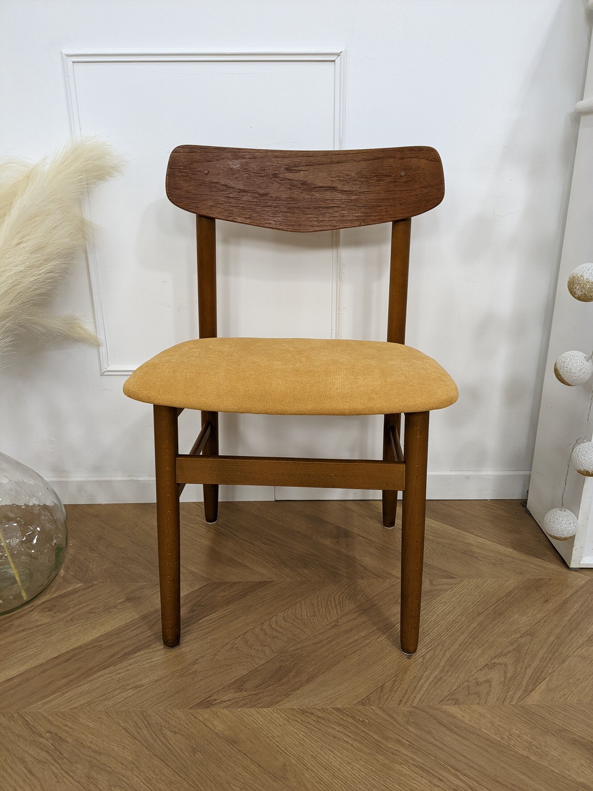 Scandinavian chair with mustard yellow fabric