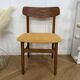 Scandinavian chair with mustard yellow fabric