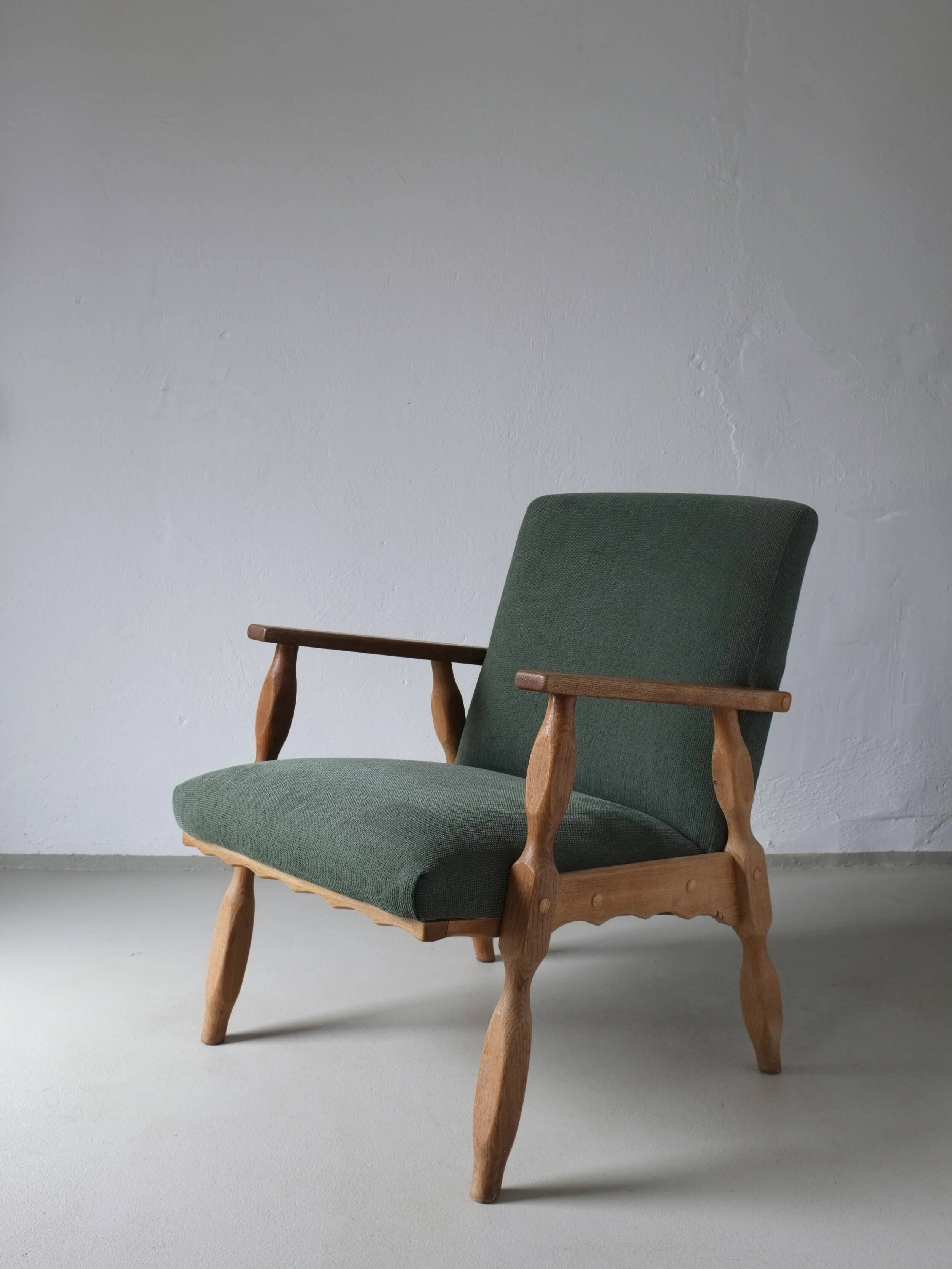 Henning Kjaernulf oak scalloped lounge chair | Denmark | 1950s