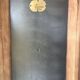 Vintage wooden wardrobe with matte cast iron color hanging rail