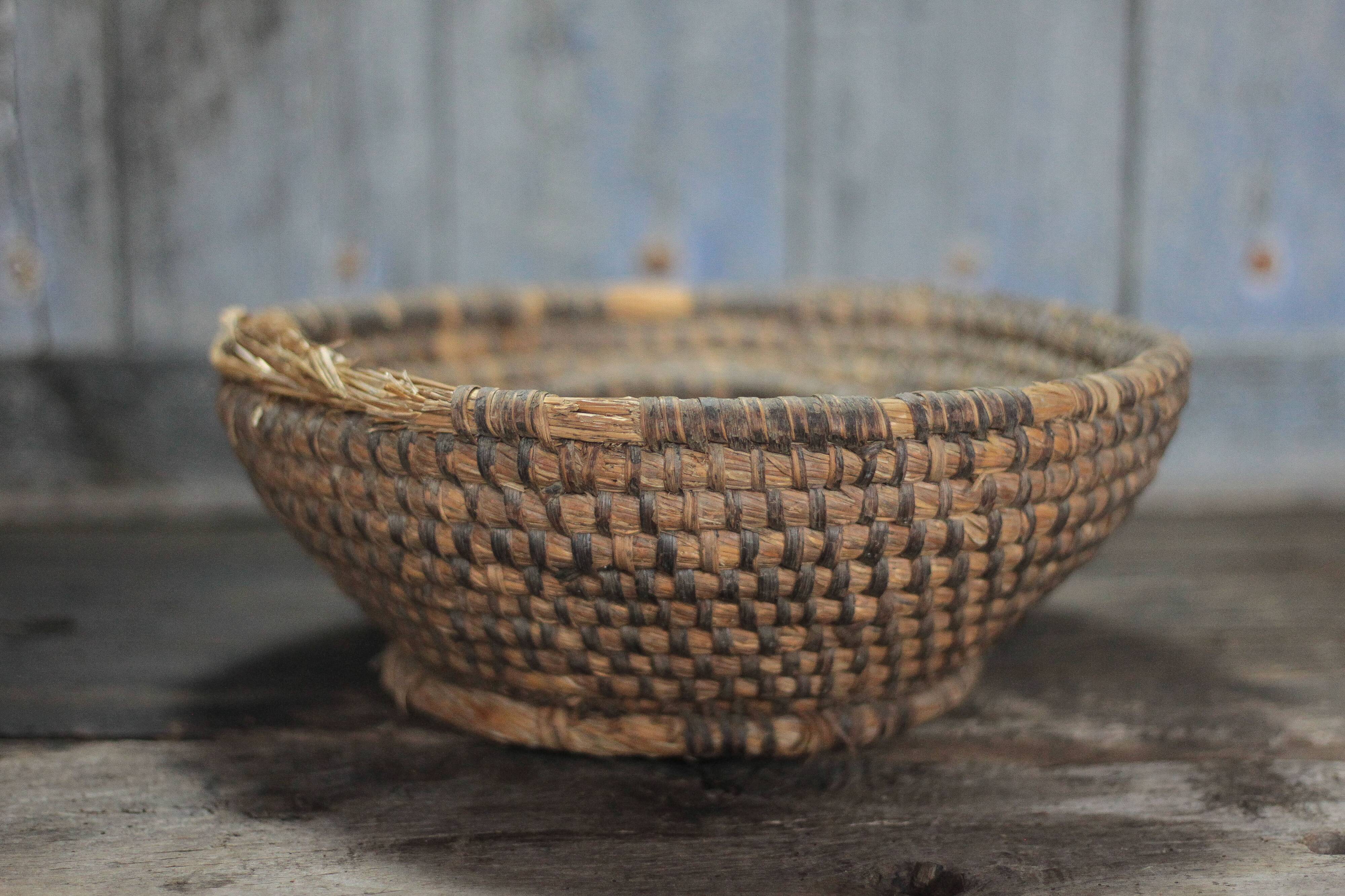 Old wicker basket, straw and bramble, woven basket, countryside.
