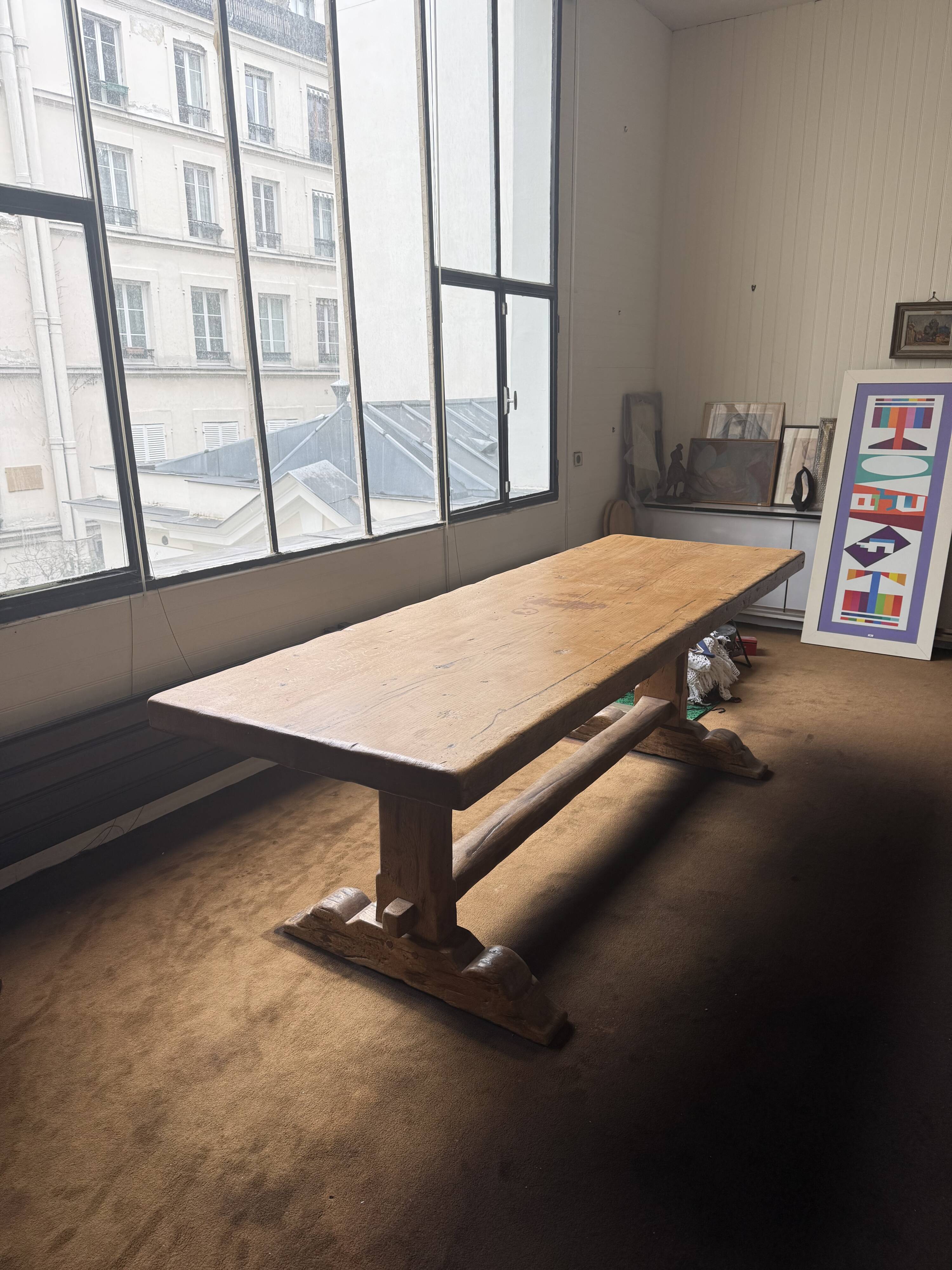 Large antique farmhouse table made of solid wood, in monastery style.