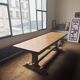 Large antique farmhouse table made of solid wood, in monastery style.