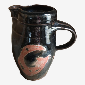 Ceramic pitcher. Belly shape. Motives on both sides