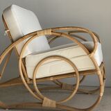 Large rattan rest chair and white cushions