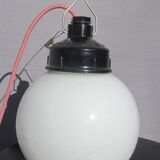 Trio of opal glass and bakelite globe pendant lights