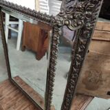 Mirror with embossed brass bead