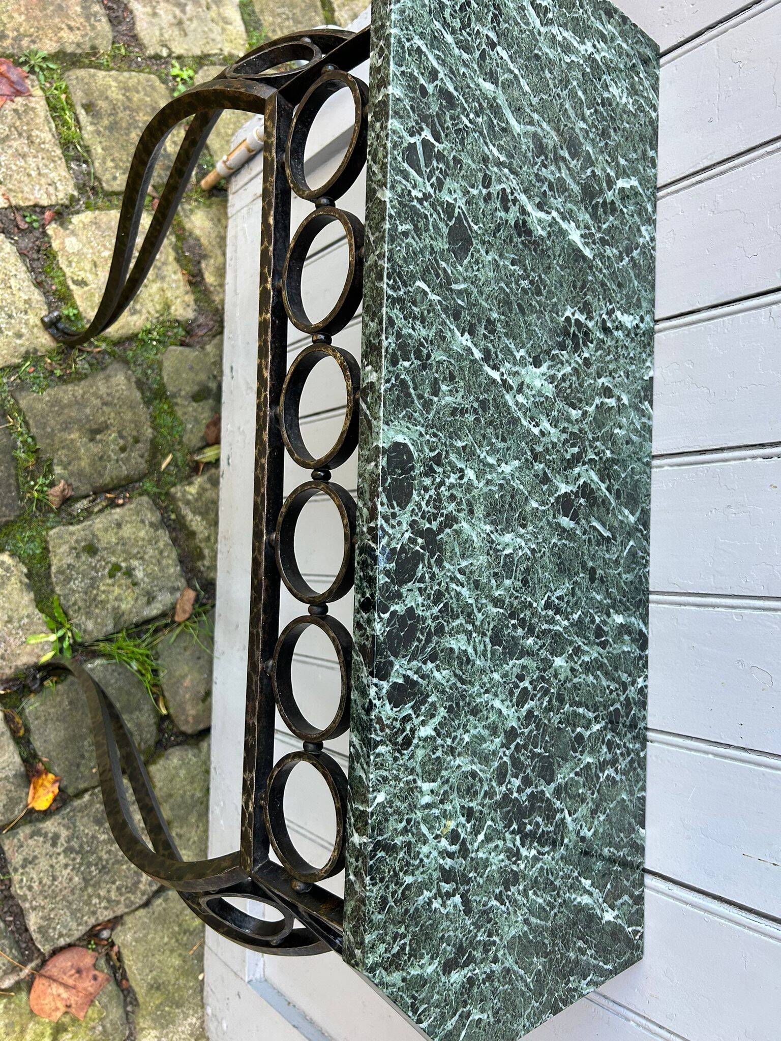Console in wrought and hammered iron and green marble
