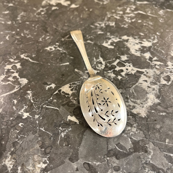 Openwork serving spoon, silver metal