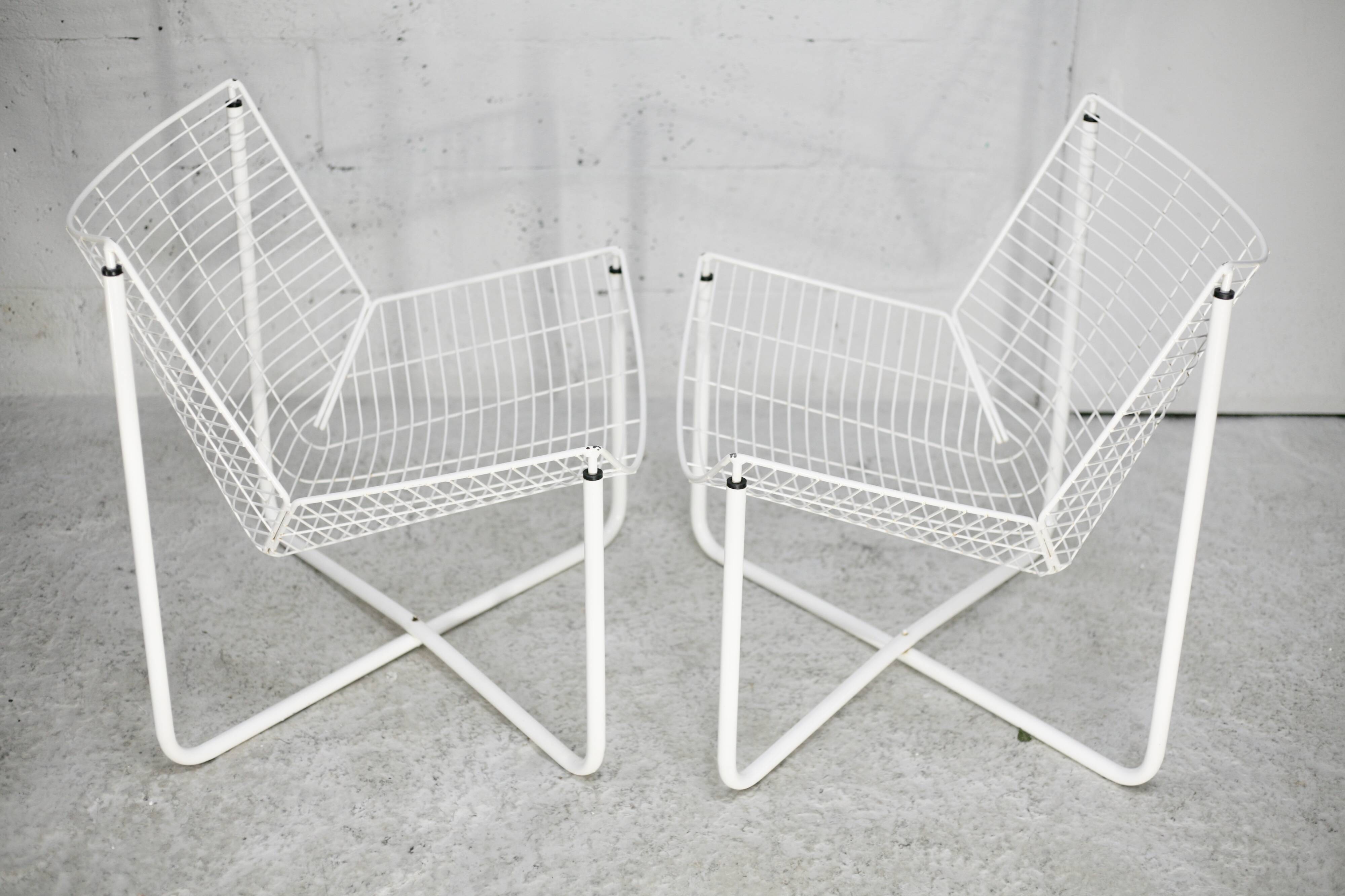Pair of white lacquered steel rod armchairs. Circa 1985