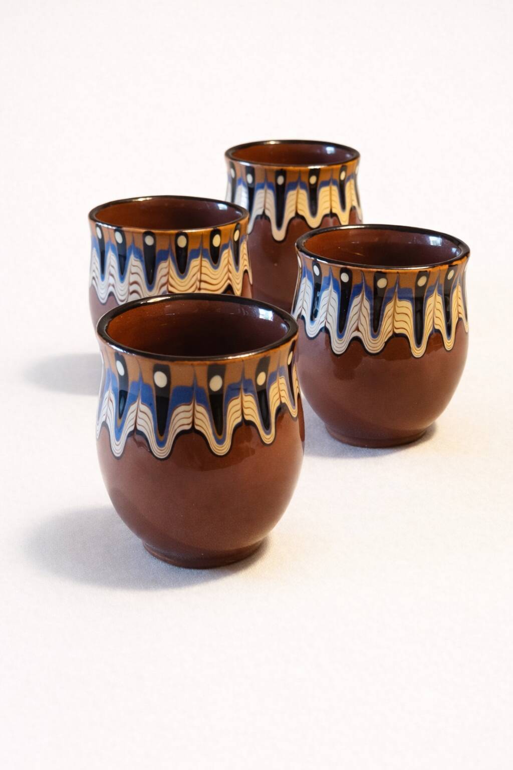 Set of 4 Bulgarian ceramic Troyan mugs from the 1970s, vintage glazed stoneware.
